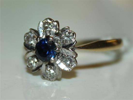 An 18ct gold, sapphire and diamond cluster ring, size Q.(-)